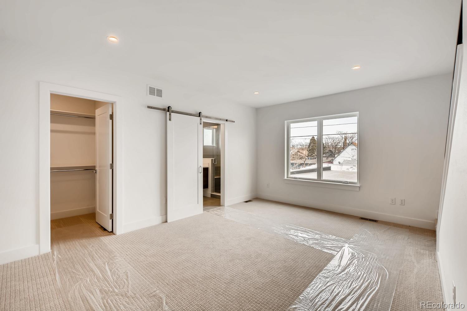 234 Inca Street Denver, CO 80223 - Photo 16 of 27 a view of an empty room with a window