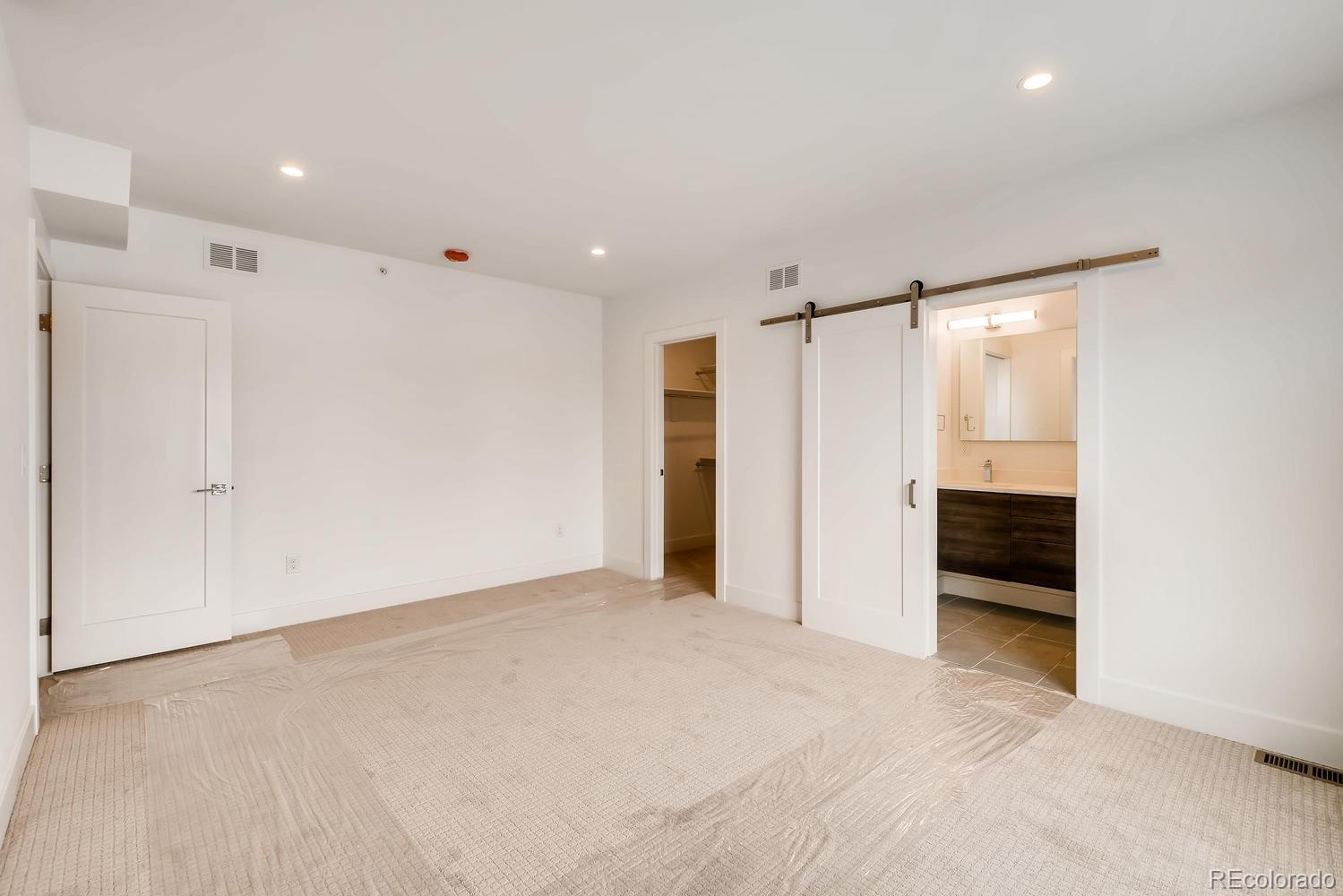 234 Inca Street Denver, CO 80223 - Photo 17 of 27 a view of an empty room with a window