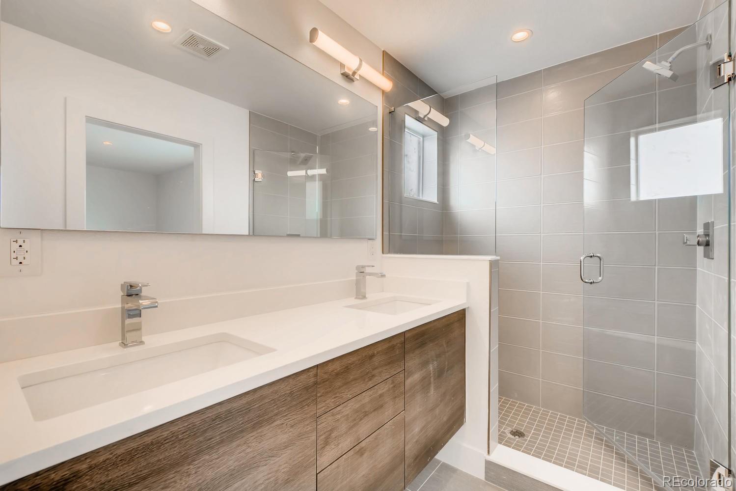234 Inca Street Denver, CO 80223 - Photo 18 of 27 a bathroom with a sink and a mirror