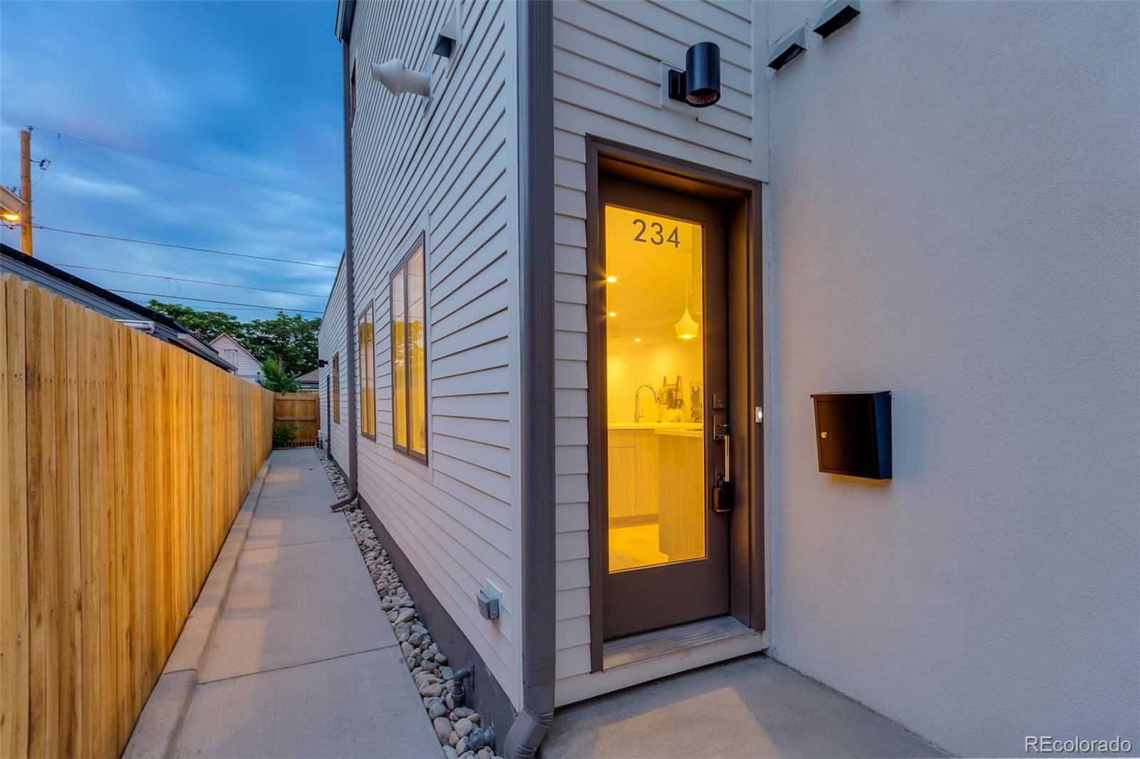 234 Inca Street Denver, CO 80223 - Photo 2 of 27 a view of a bathroom with a bathtub and door