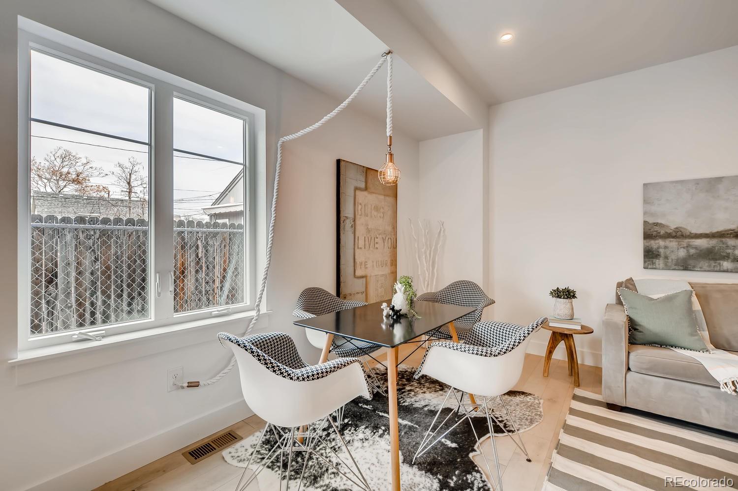 234 Inca Street Denver, CO 80223 - Photo 21 of 27 a living room with furniture and a large window