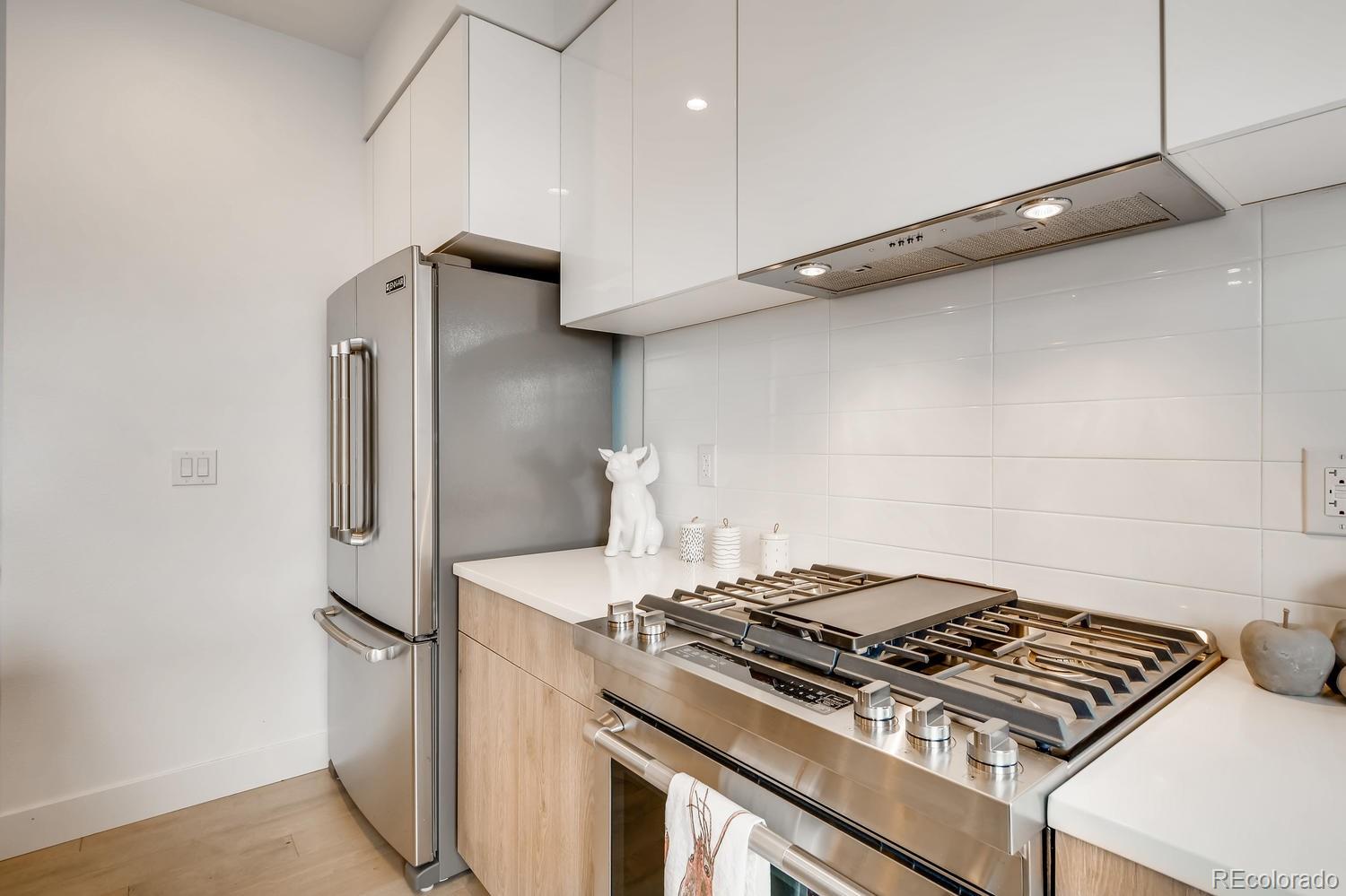 234 Inca Street Denver, CO 80223 - Photo 22 of 27 a stove top oven sitting inside of a kitchen