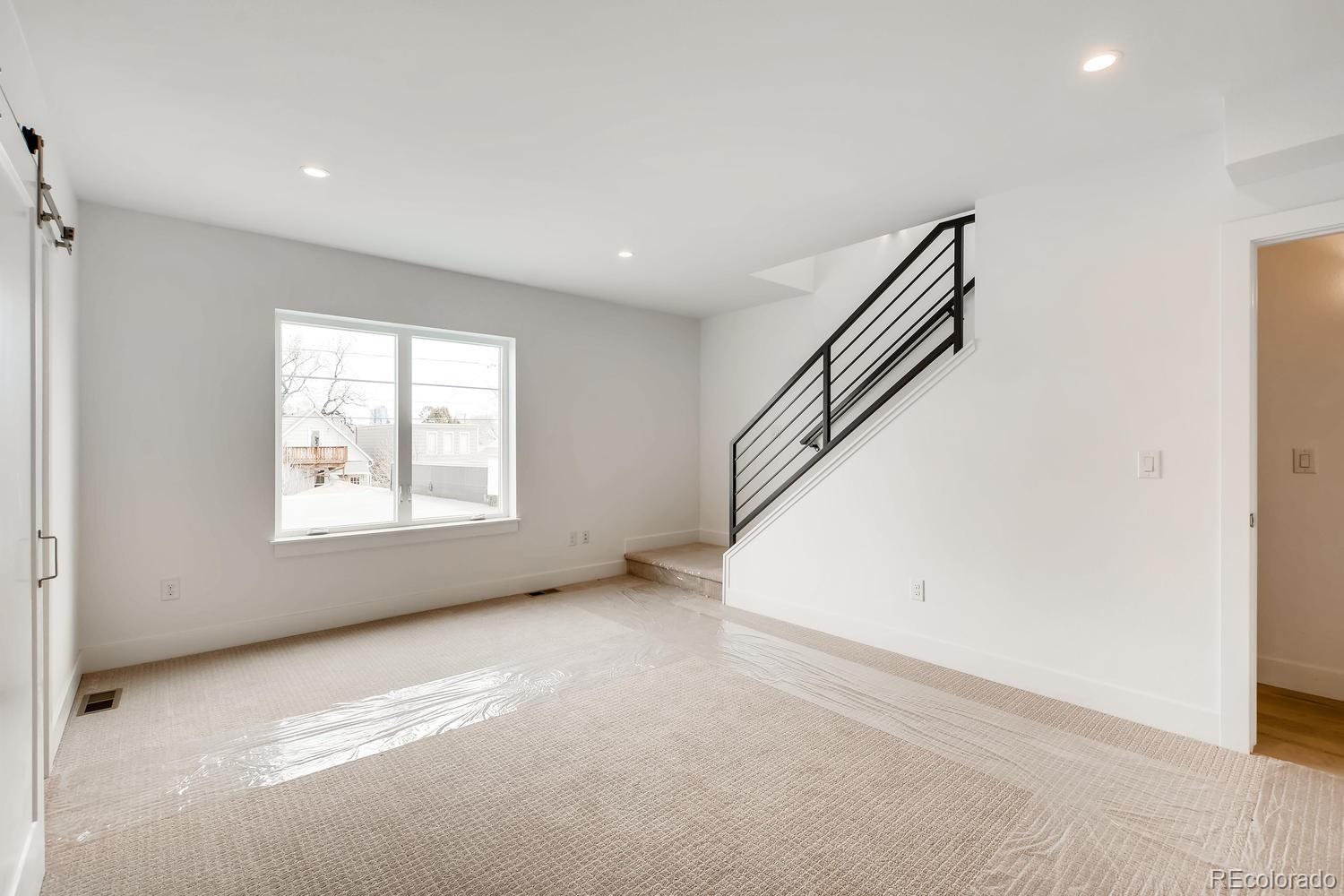 234 Inca Street Denver, CO 80223 - Photo 24 of 27 a view of an empty room with a window