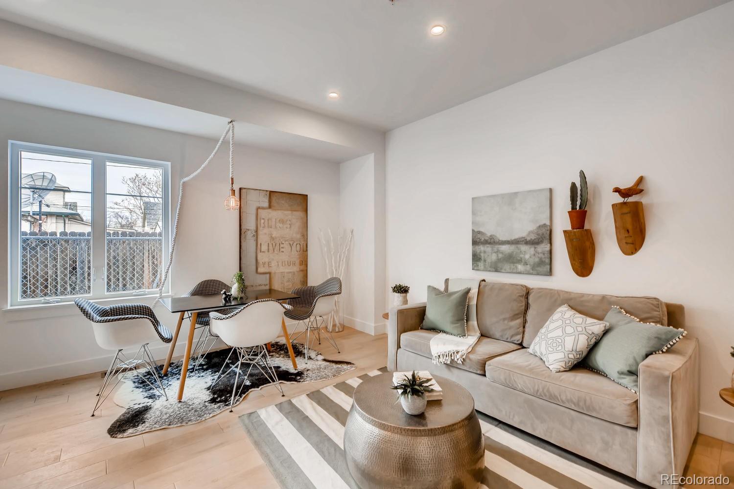 234 Inca Street Denver, CO 80223 - Photo 5 of 27 a living room with furniture and a large window