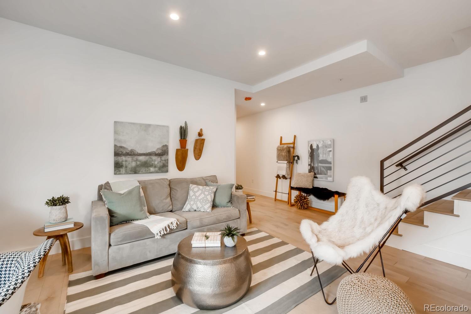 234 Inca Street Denver, CO 80223 - Photo 6 of 27 a living room with furniture and wooden floor