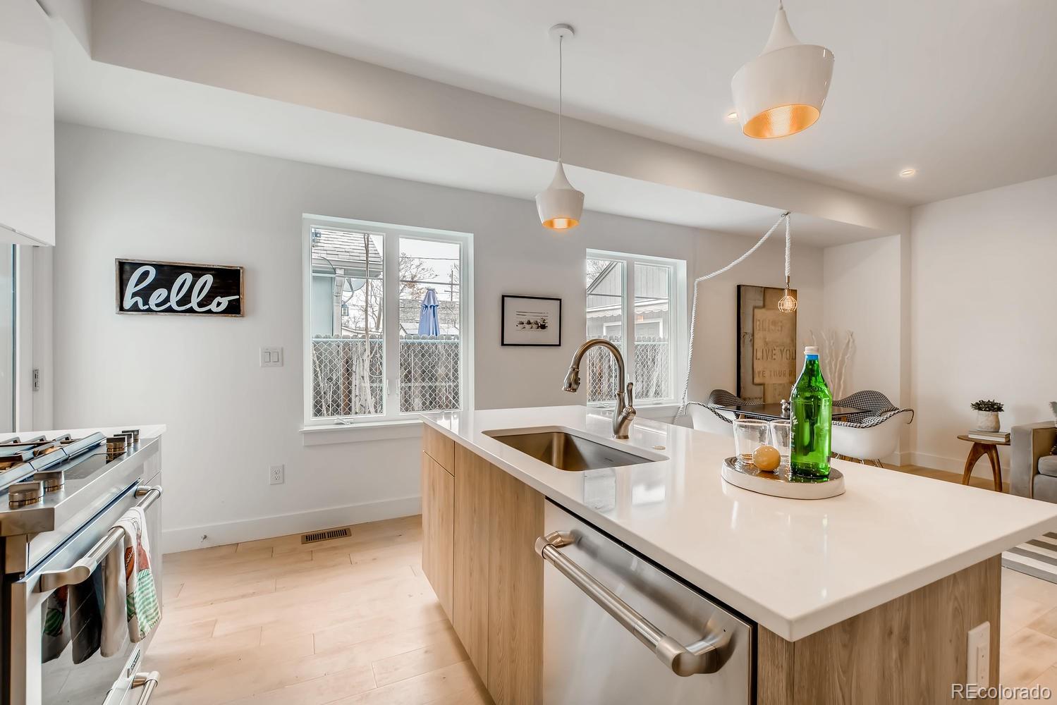 234 Inca Street Denver, CO 80223 - Photo 9 of 27 a kitchen that has a sink and a stove