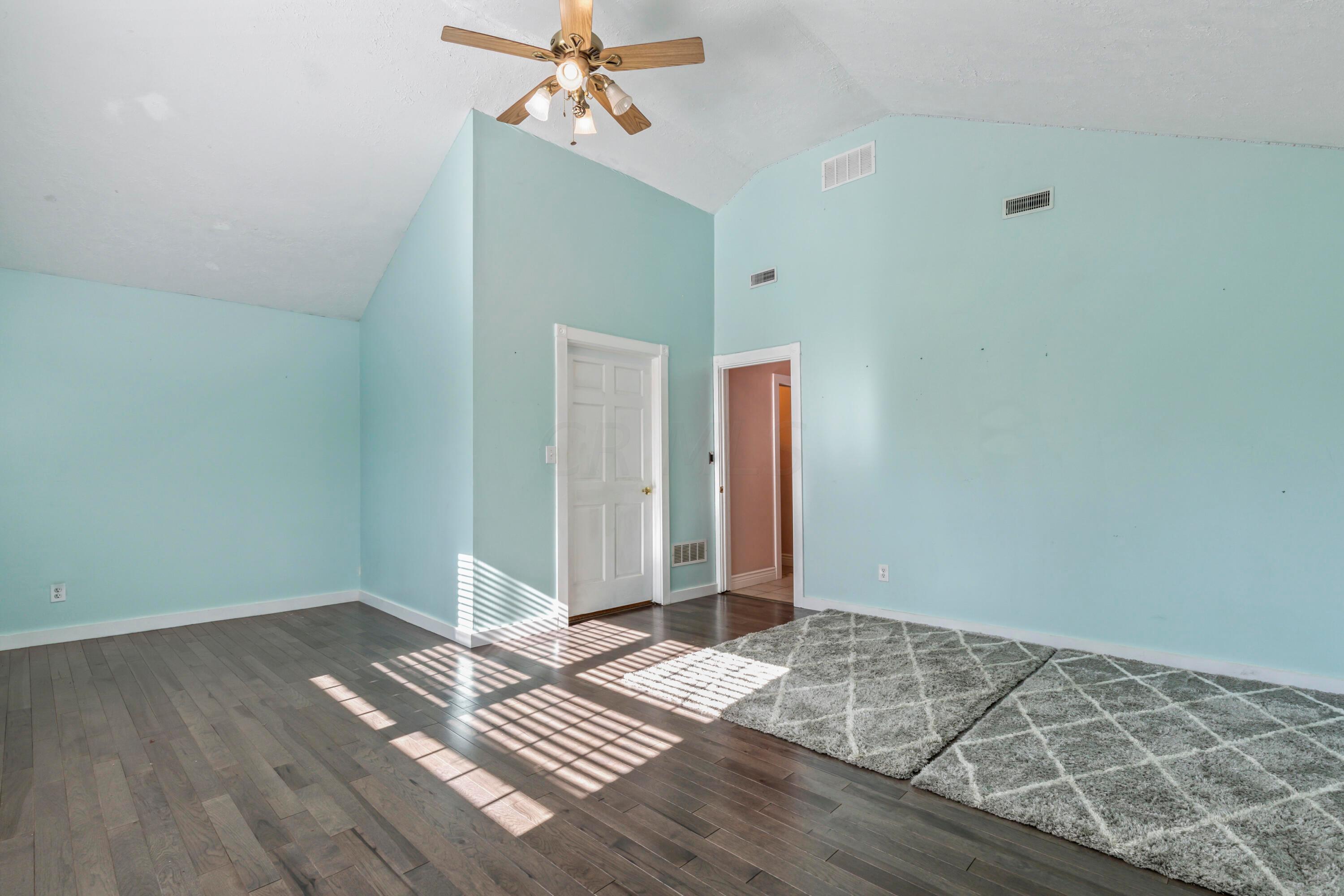 9495 Kilbourne Road Sunbury, OH 43074 - Photo 50 of 84 • New hickory wood flooring
~ 2021
• Mint painted walls
• Coffered ceiling
• Platform
• Lighted ceiling fan
• New windows ~ 2021