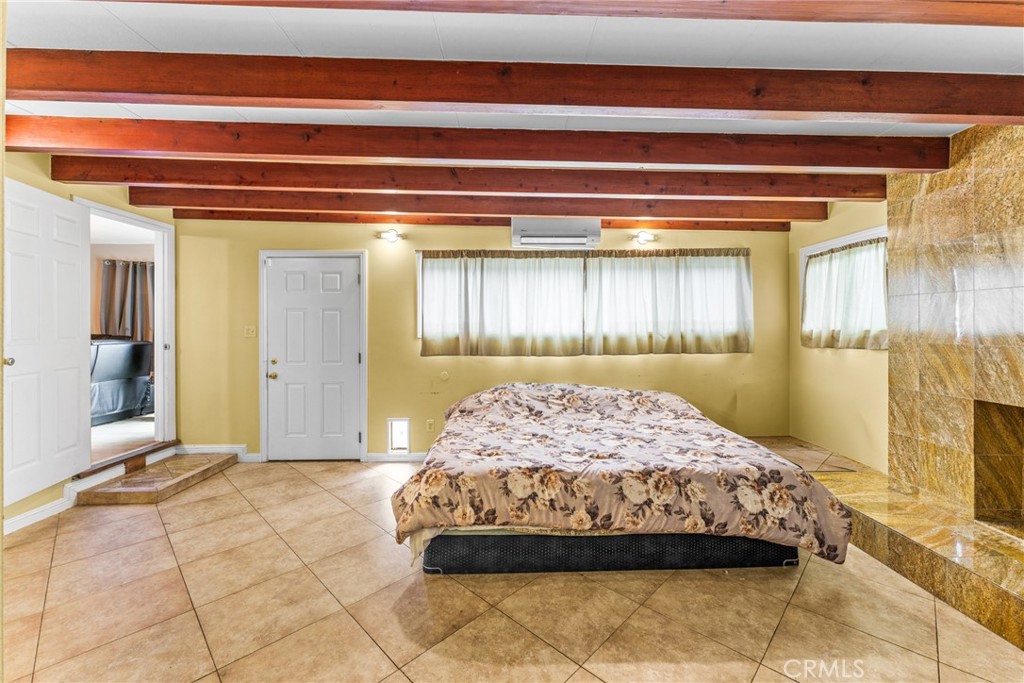 7977 Vista Del Rosa Street Downey, CA 90240 - Photo 16 of 53 a bedroom with a bed and a mirror