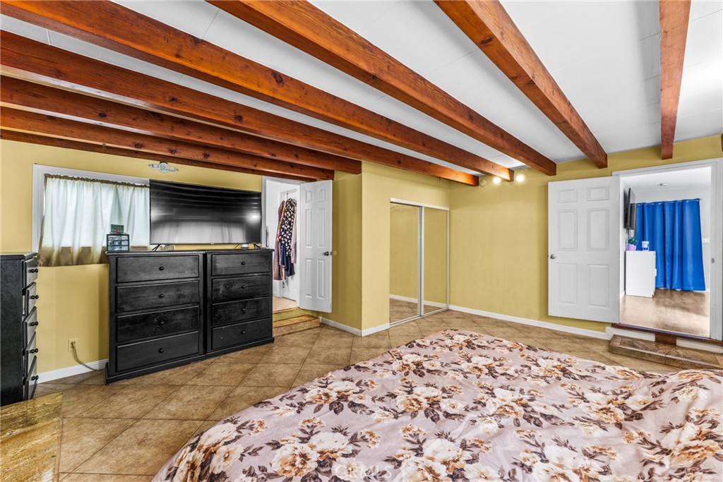 7977 Vista Del Rosa Street Downey, CA 90240 - Photo 17 of 53 a bedroom with a bed and a television