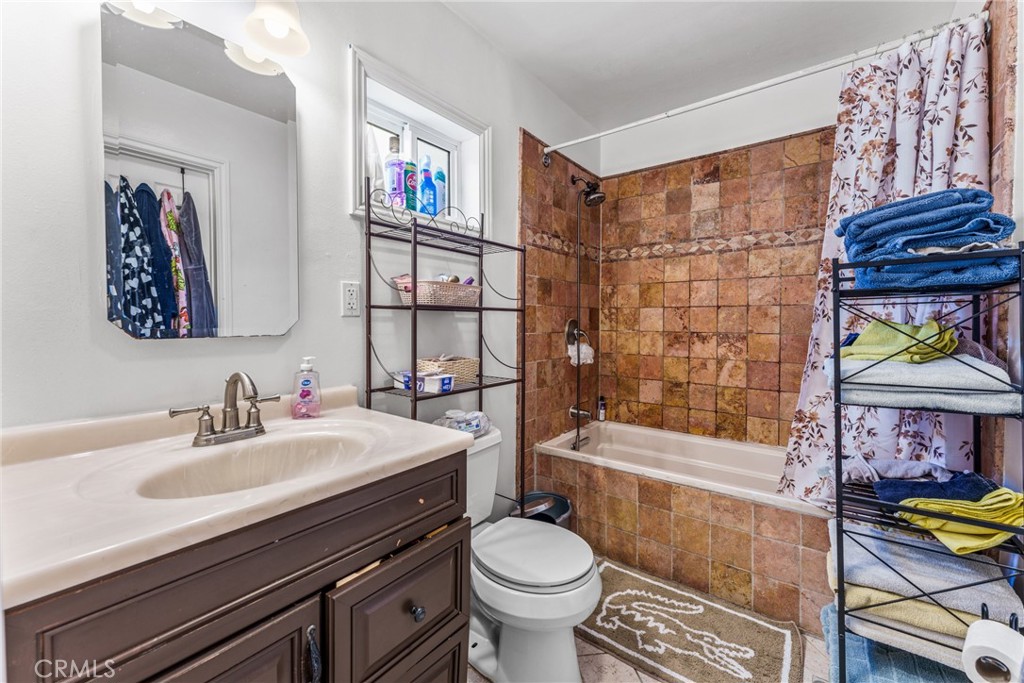 7977 Vista Del Rosa Street Downey, CA 90240 - Photo 18 of 53 a bathroom with a sink toilet and shower