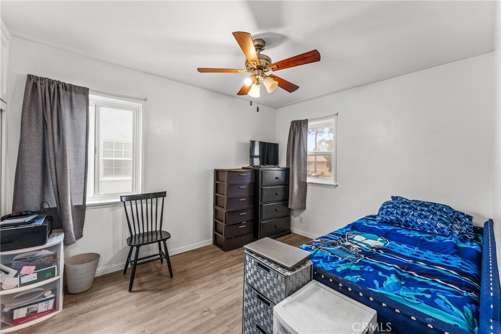7977 Vista Del Rosa Street Downey, CA 90240 - Photo 19 of 53 a living room with furniture and wooden floor