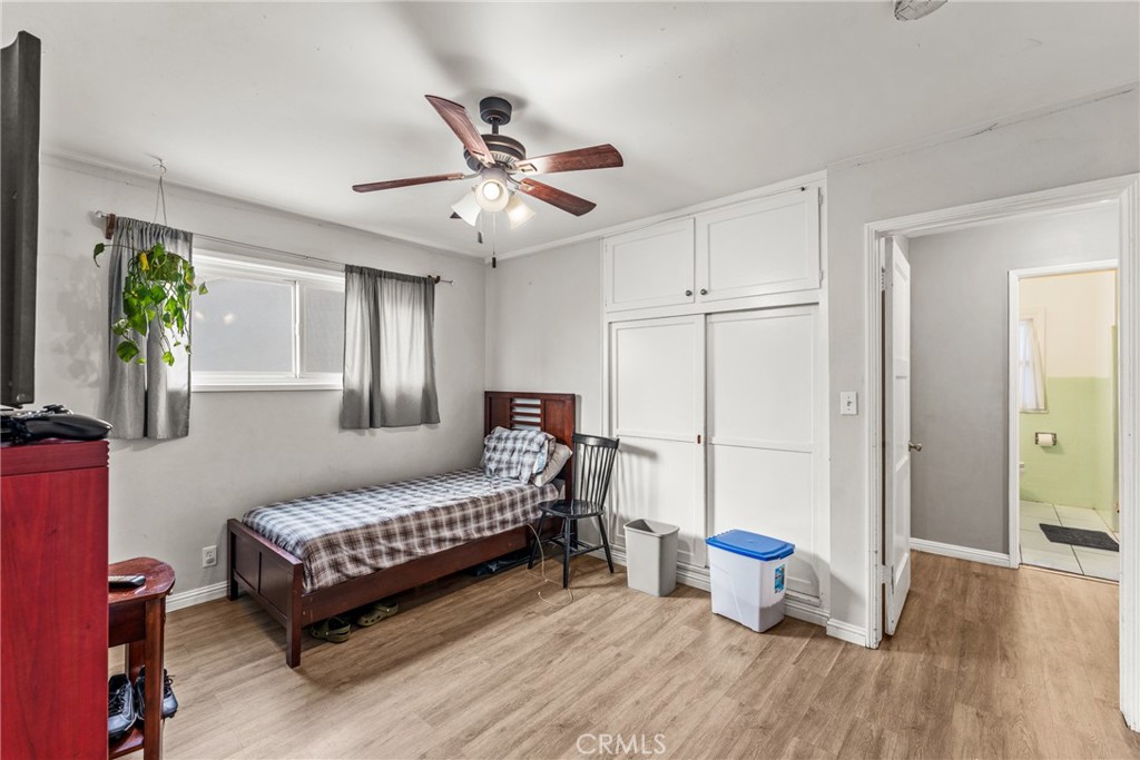 7977 Vista Del Rosa Street Downey, CA 90240 - Photo 22 of 53 a bedroom with a bed and a chandelier