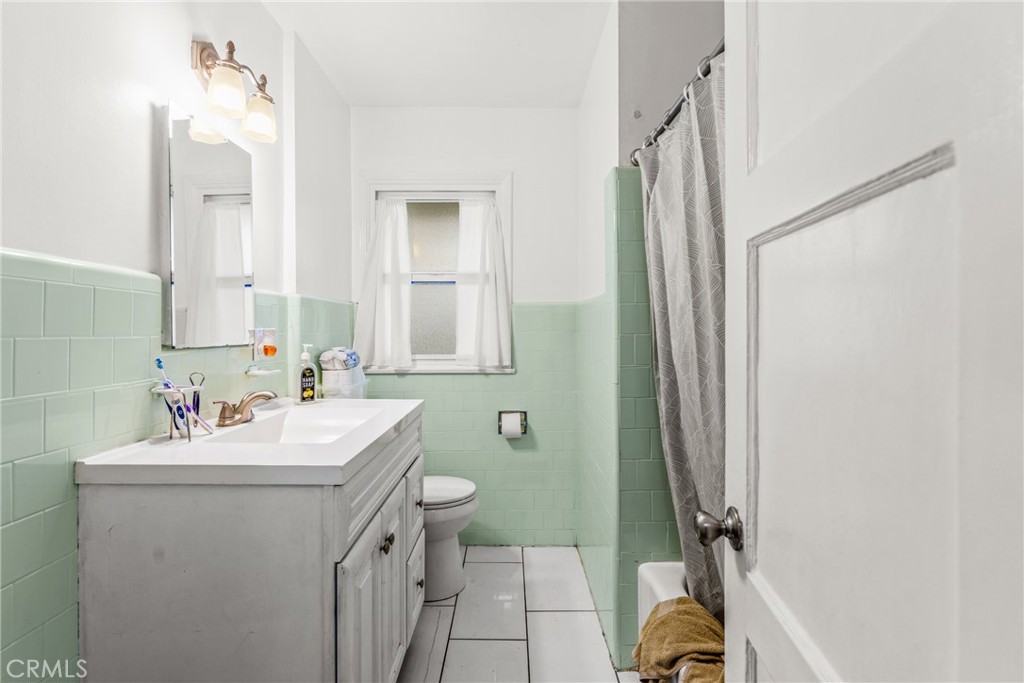7977 Vista Del Rosa Street Downey, CA 90240 - Photo 23 of 53 a bathroom with a sink toilet and shower