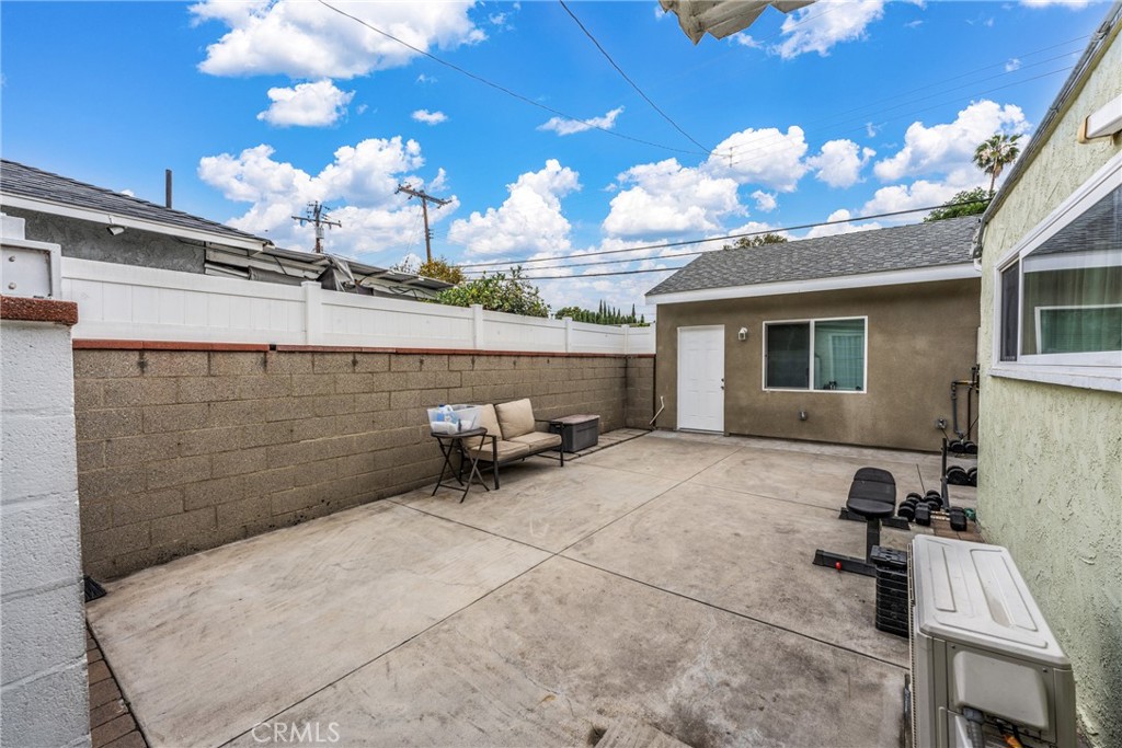 7977 Vista Del Rosa Street Downey, CA 90240 - Photo 24 of 53 a backyard of a house with table and chairs