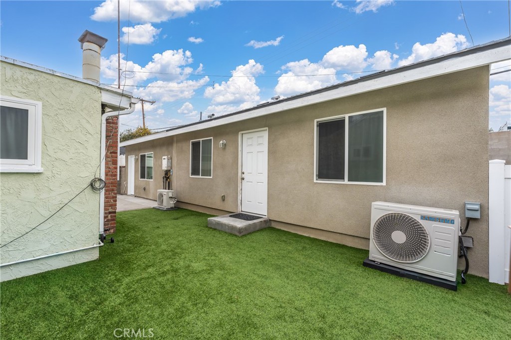 7977 Vista Del Rosa Street Downey, CA 90240 - Photo 28 of 53 a backyard of a house with table and chairs