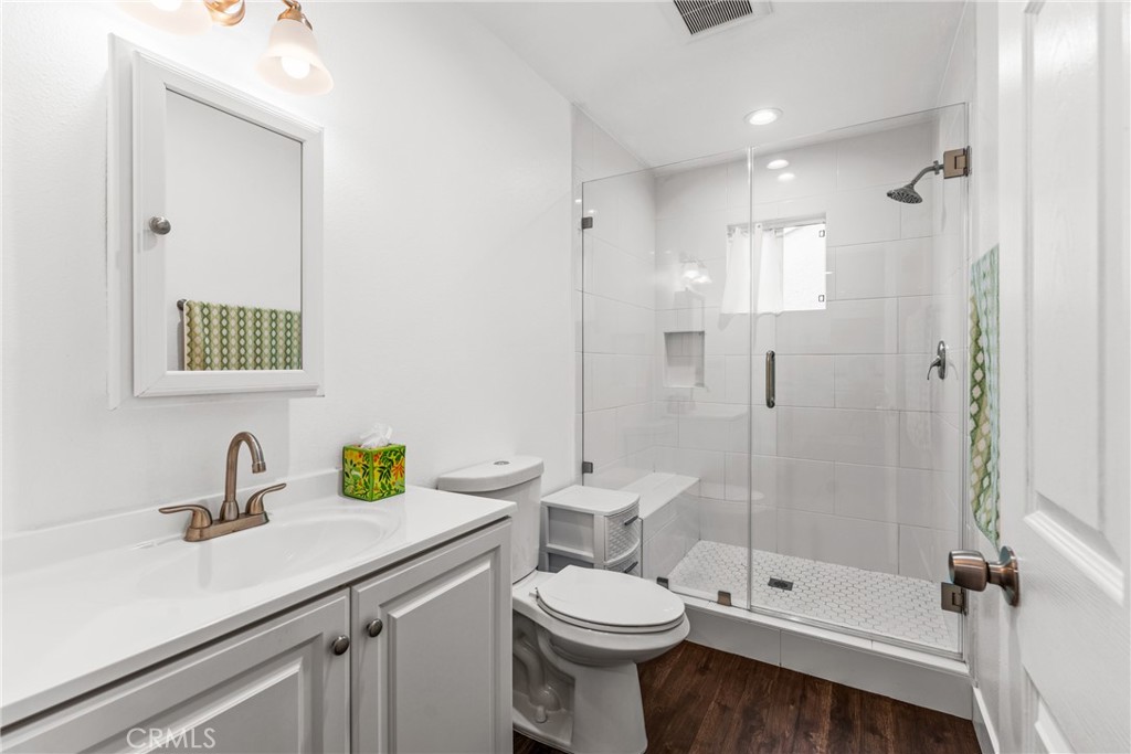 7977 Vista Del Rosa Street Downey, CA 90240 - Photo 37 of 53 a bathroom with a sink a toilet and shower
