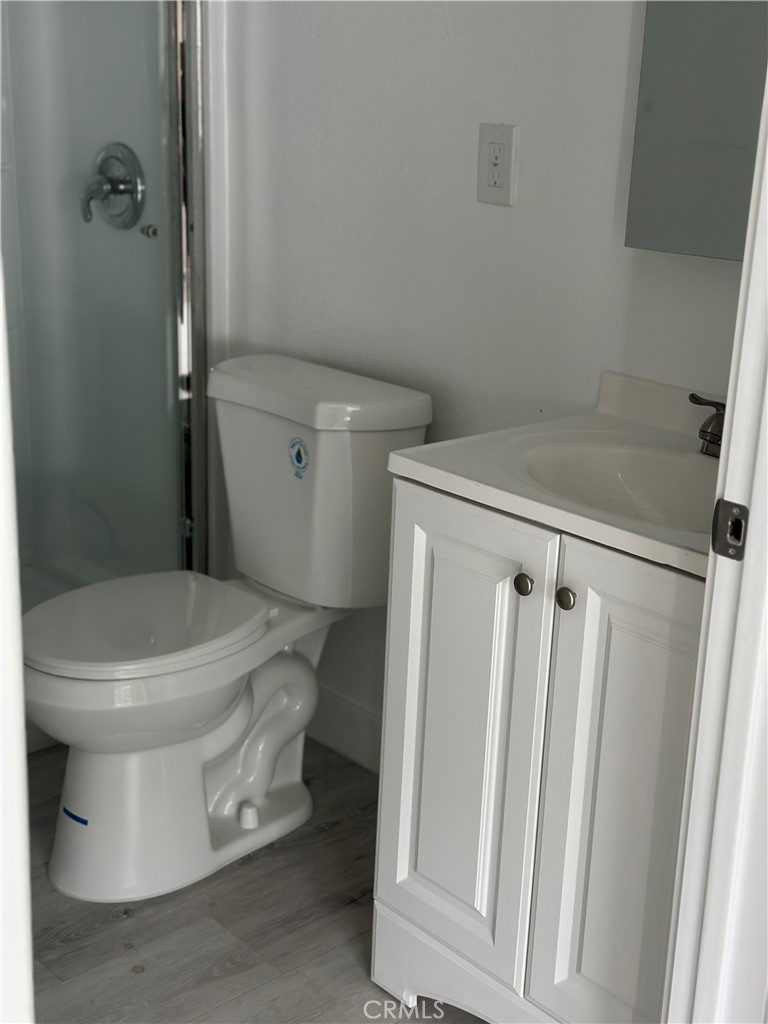 7977 Vista Del Rosa Street Downey, CA 90240 - Photo 44 of 53 a white toilet sitting next to a sink