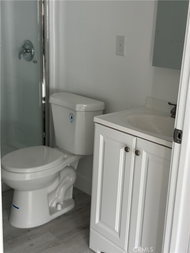 7977 Vista Del Rosa Street Downey, CA 90240 - Photo 45 of 53 a white toilet sitting next to a shower