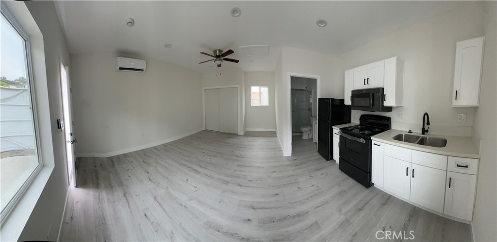 7977 Vista Del Rosa Street Downey, CA 90240 - Photo 47 of 53 a kitchen with a refrigerator and a stove top oven