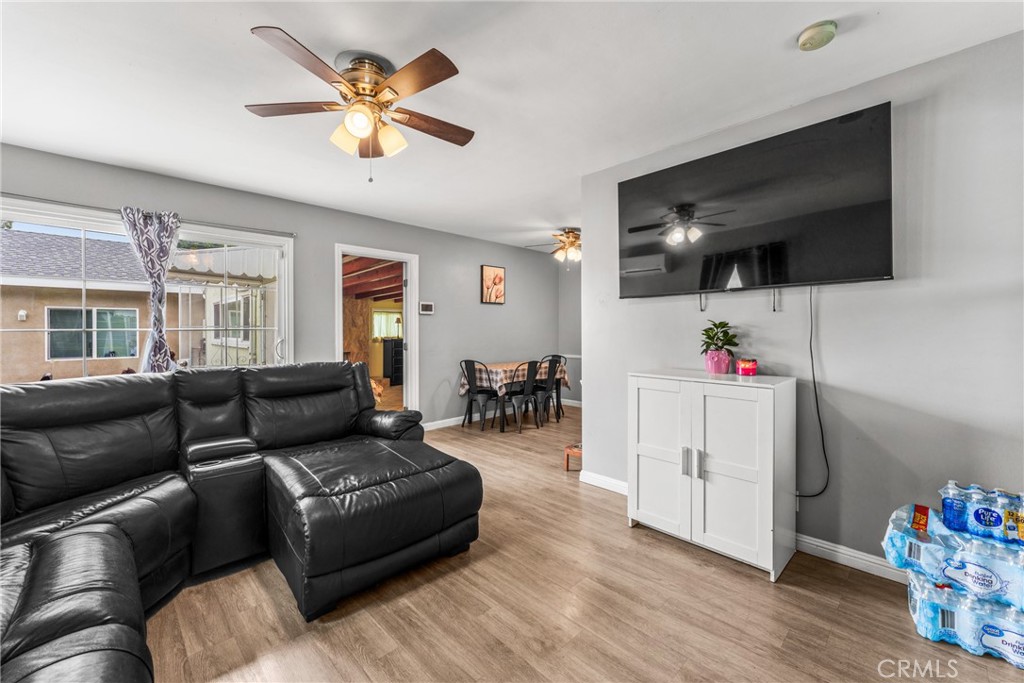 7977 Vista Del Rosa Street Downey, CA 90240 - Photo 7 of 53 a living room with furniture and flat screen tv