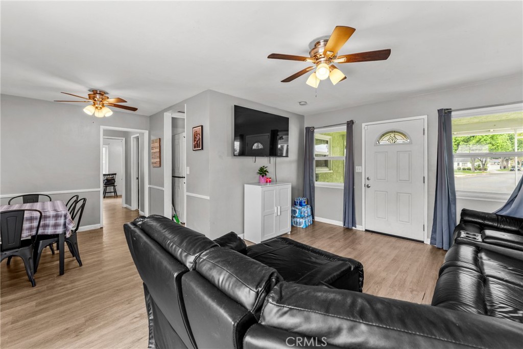 7977 Vista Del Rosa Street Downey, CA 90240 - Photo 10 of 53 a living room with furniture and a flat screen tv