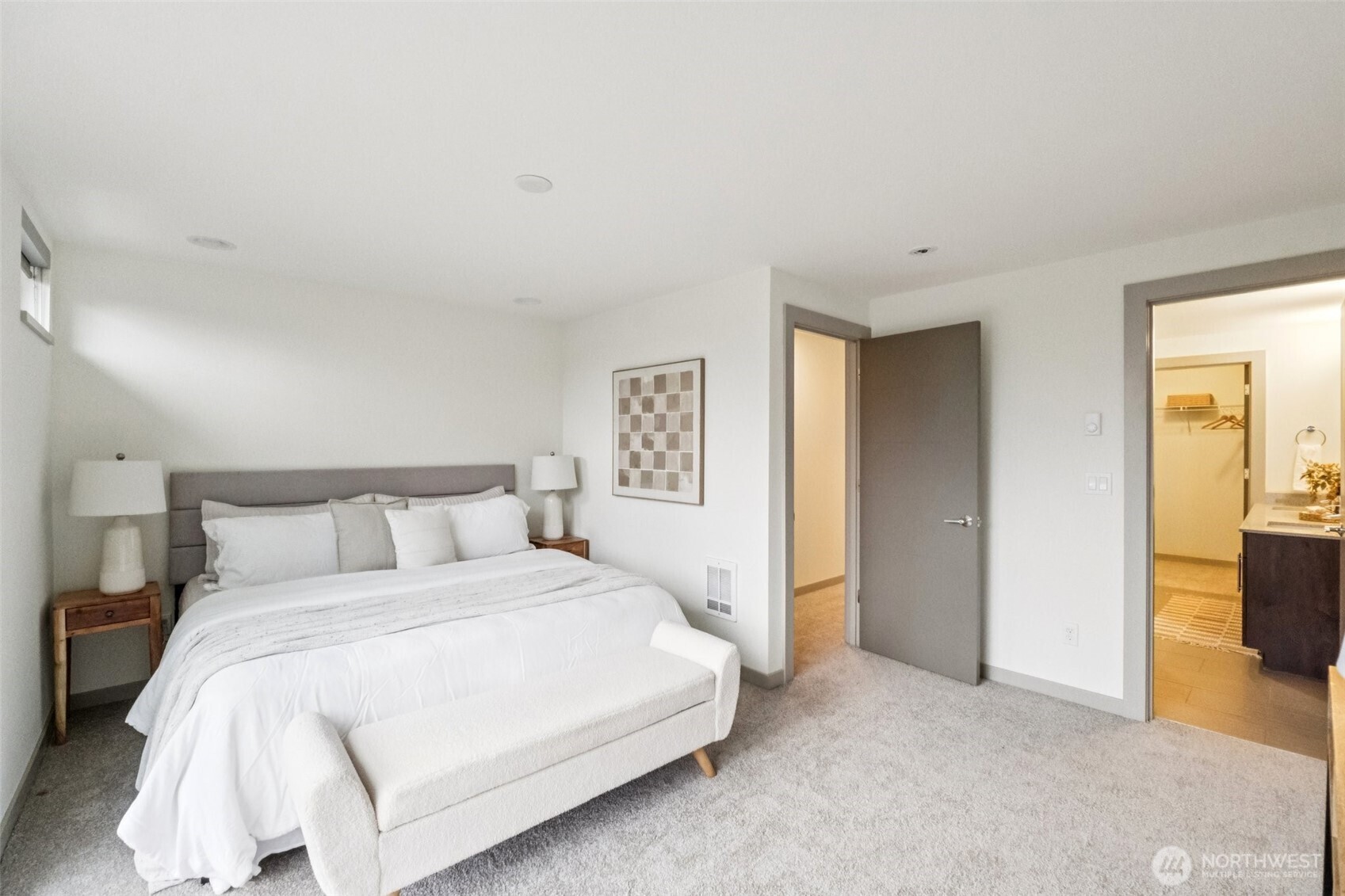 10503 Evanston Avenue North, Unit C Seattle, WA 98133 - Photo 17 of 25 a bedroom with a bed and a couch