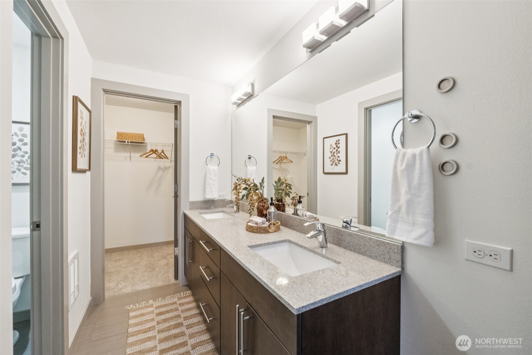10503 Evanston Avenue North, Unit C Seattle, WA 98133 - Photo 19 of 25 a bathroom with a sink a mirror and a shower