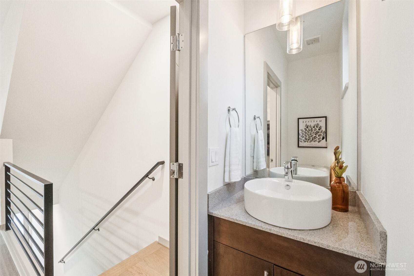 10503 Evanston Avenue North, Unit C Seattle, WA 98133 - Photo 8 of 25 a bathroom with a sink and a mirror
