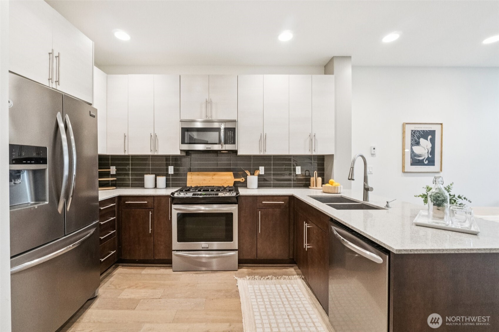 10503 Evanston Avenue North, Unit C Seattle, WA 98133 - Photo 9 of 25 a kitchen with stainless steel appliances granite countertop a sink stove and refrigerator