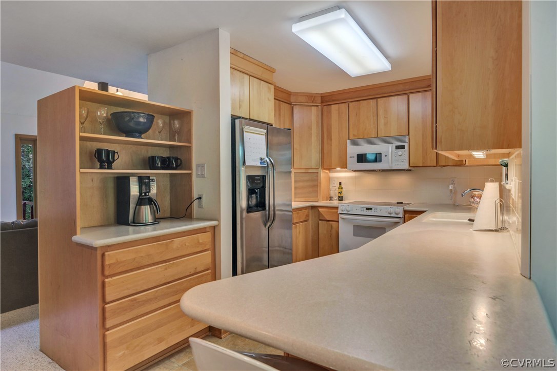 3307 7 Oaks Road Midlothian, VA 23112 - Photo 11 of 33 a kitchen with a refrigerator and a sink