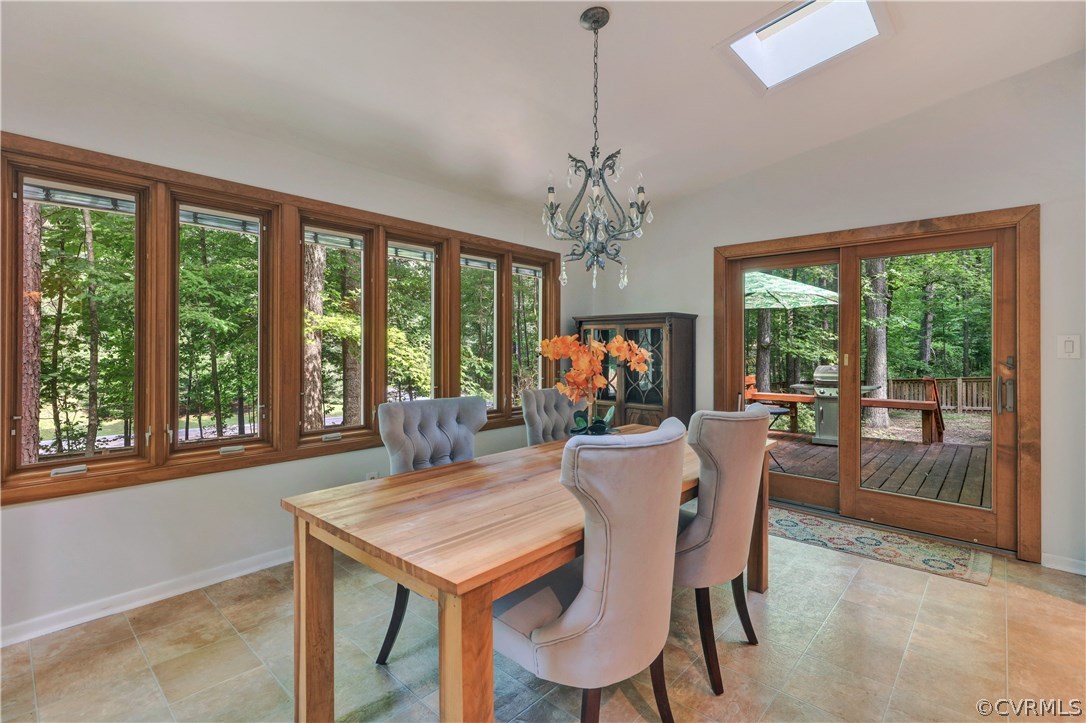 3307 7 Oaks Road Midlothian, VA 23112 - Photo 15 of 33 a view of a dining room with furniture large windows and wooden floor