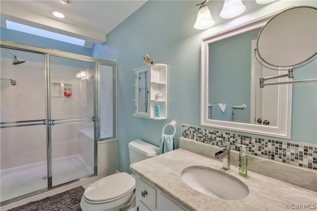 3307 7 Oaks Road Midlothian, VA 23112 - Photo 18 of 33 a bathroom with a sink vanity mirror and toilet