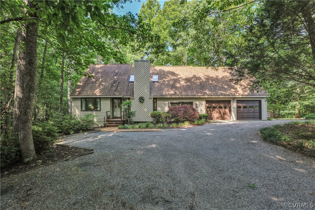 3307 7 Oaks Road Midlothian, VA 23112 - Photo 3 of 33 a view of house with outdoor space and a car parked in it