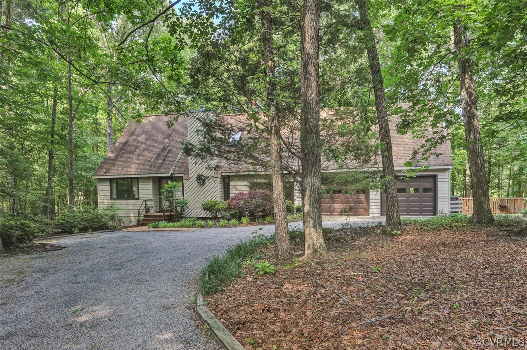 3307 7 Oaks Road Midlothian, VA 23112 - Photo 33 of 33 a front view of a house with a yard and large trees