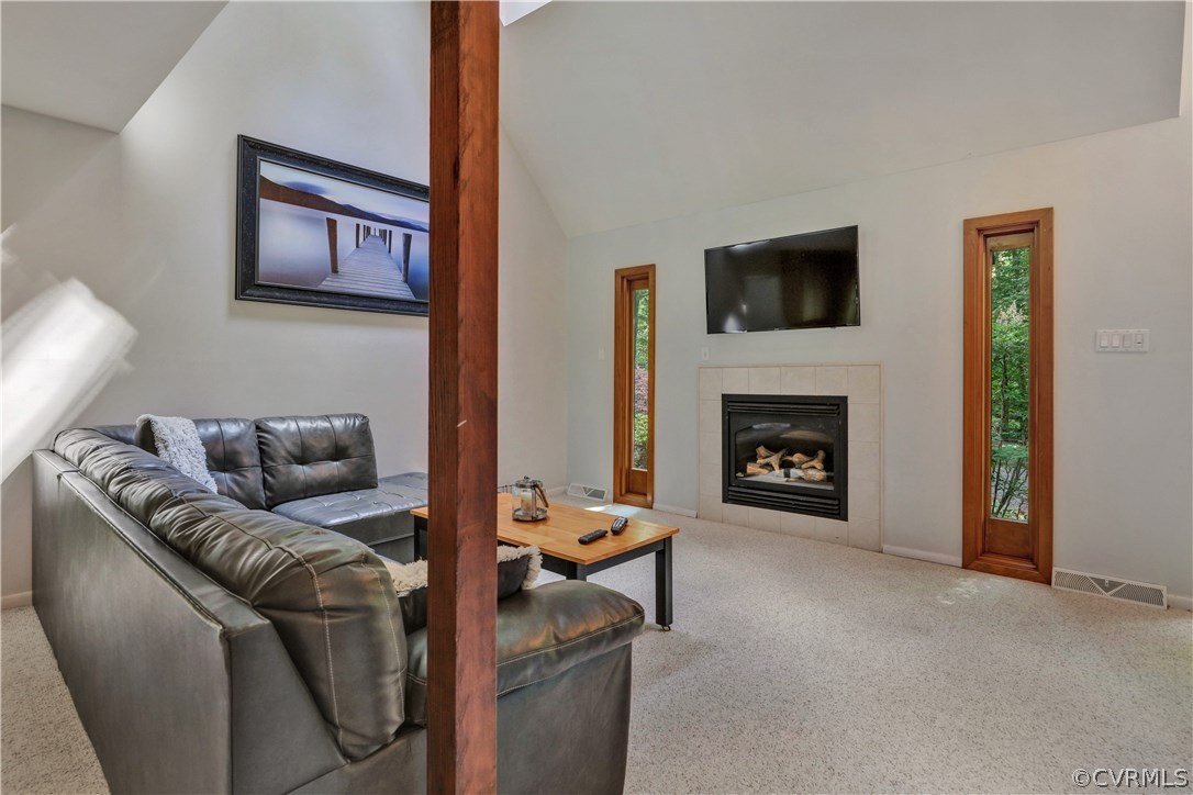 3307 7 Oaks Road Midlothian, VA 23112 - Photo 5 of 33 a living room with furniture a flat screen tv and a fireplace