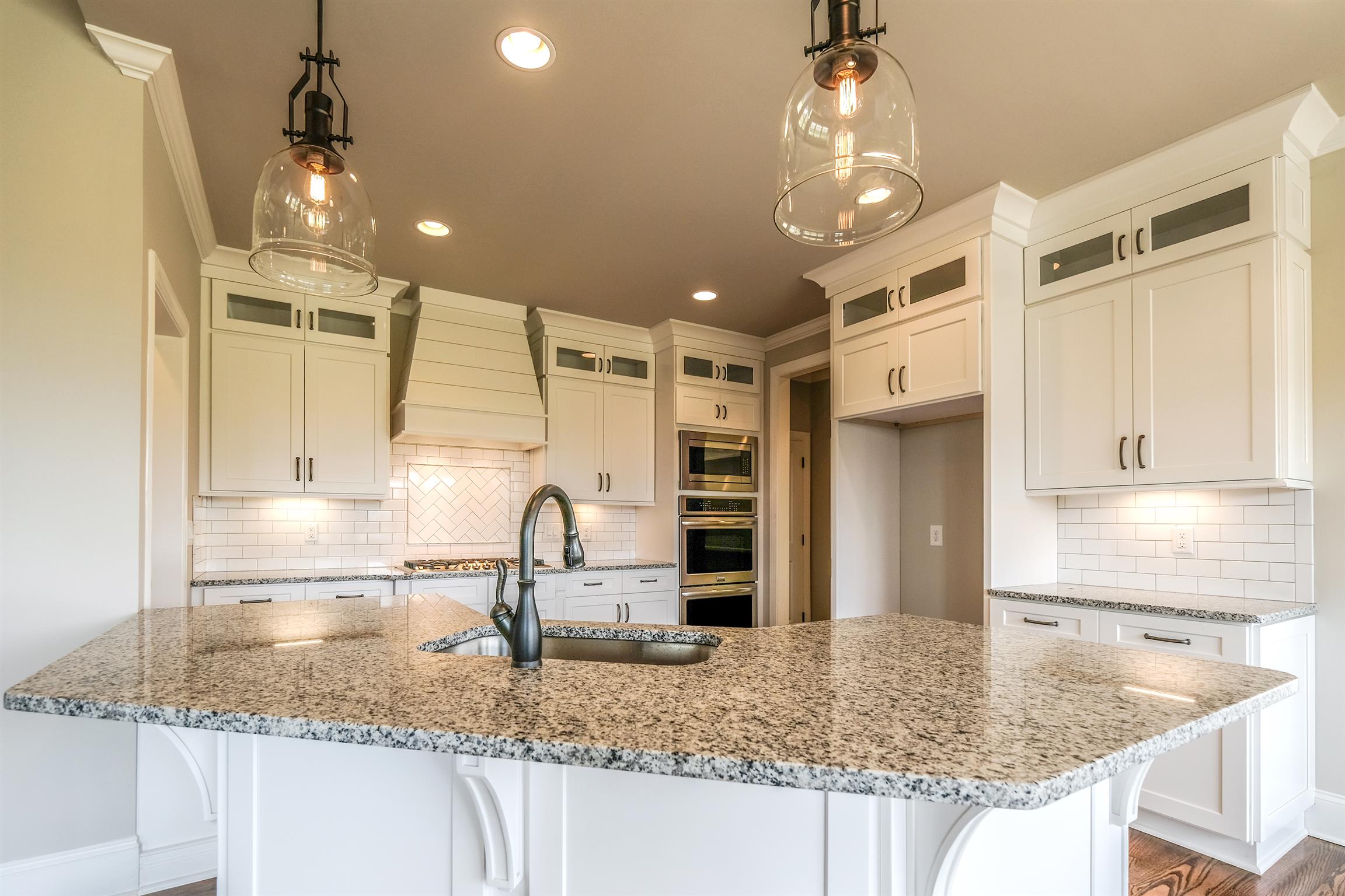 2029 Autumn Ridge Way Spring Hill, TN 37174 - Photo 7 of 30 Granite, stainless appliances, gas cooktop, double ovens, microwave, on trend lighting.