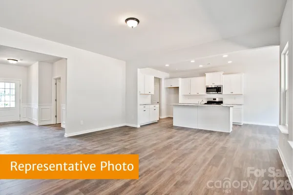 a view of kitchen view with wooden floor and window