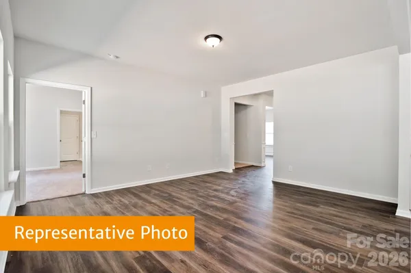a view of an empty room and wooden floor