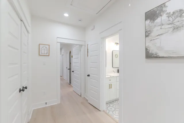 wooden floor with white walls