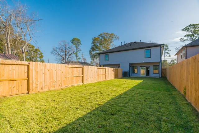 a view of a backyard with a garden and plants