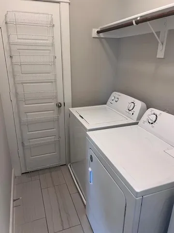 an empty room with a empty space and windows