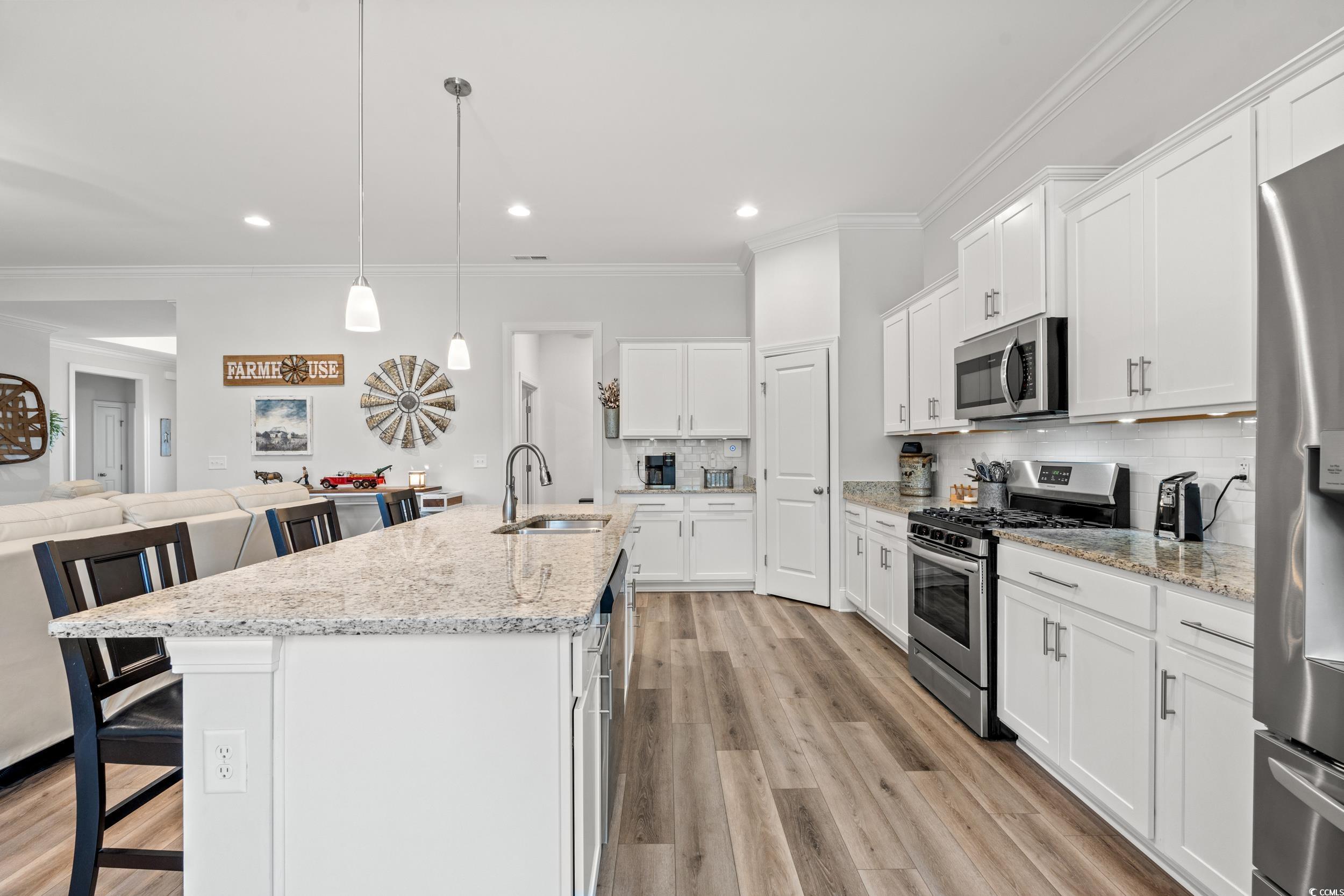 641 Indigo Bay Circle Myrtle Beach, SC 29579 - Photo 12 of 39 Kitchen with decorative light fixtures, an island