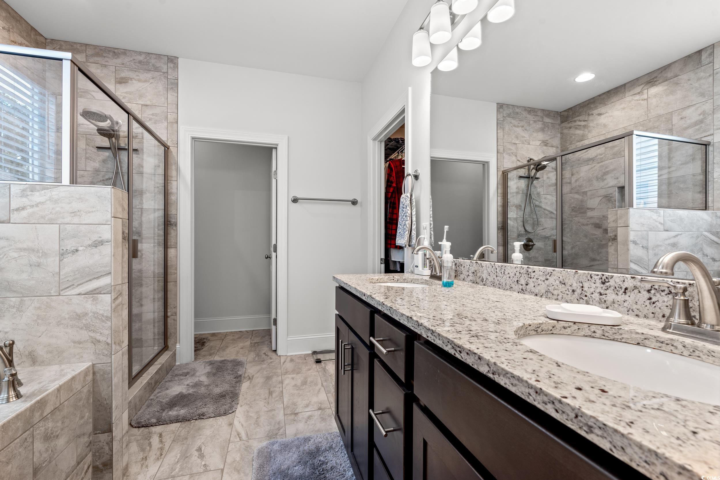 641 Indigo Bay Circle Myrtle Beach, SC 29579 - Photo 17 of 39 Bathroom featuring vanity and an enclosed shower