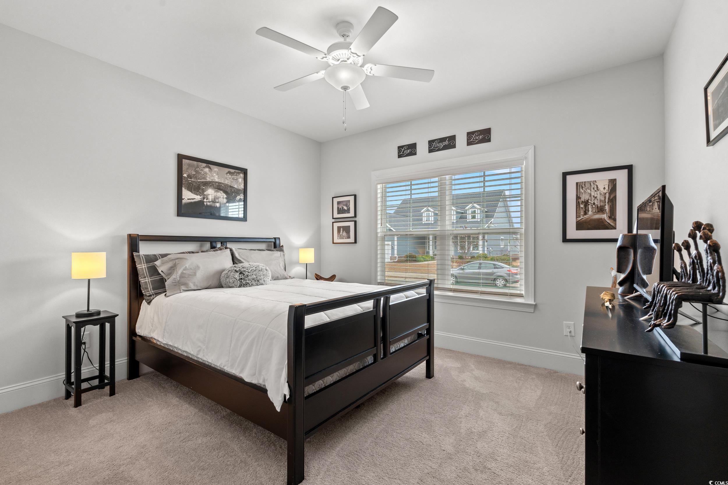 641 Indigo Bay Circle Myrtle Beach, SC 29579 - Photo 18 of 39 Bedroom with light carpet and ceiling fan