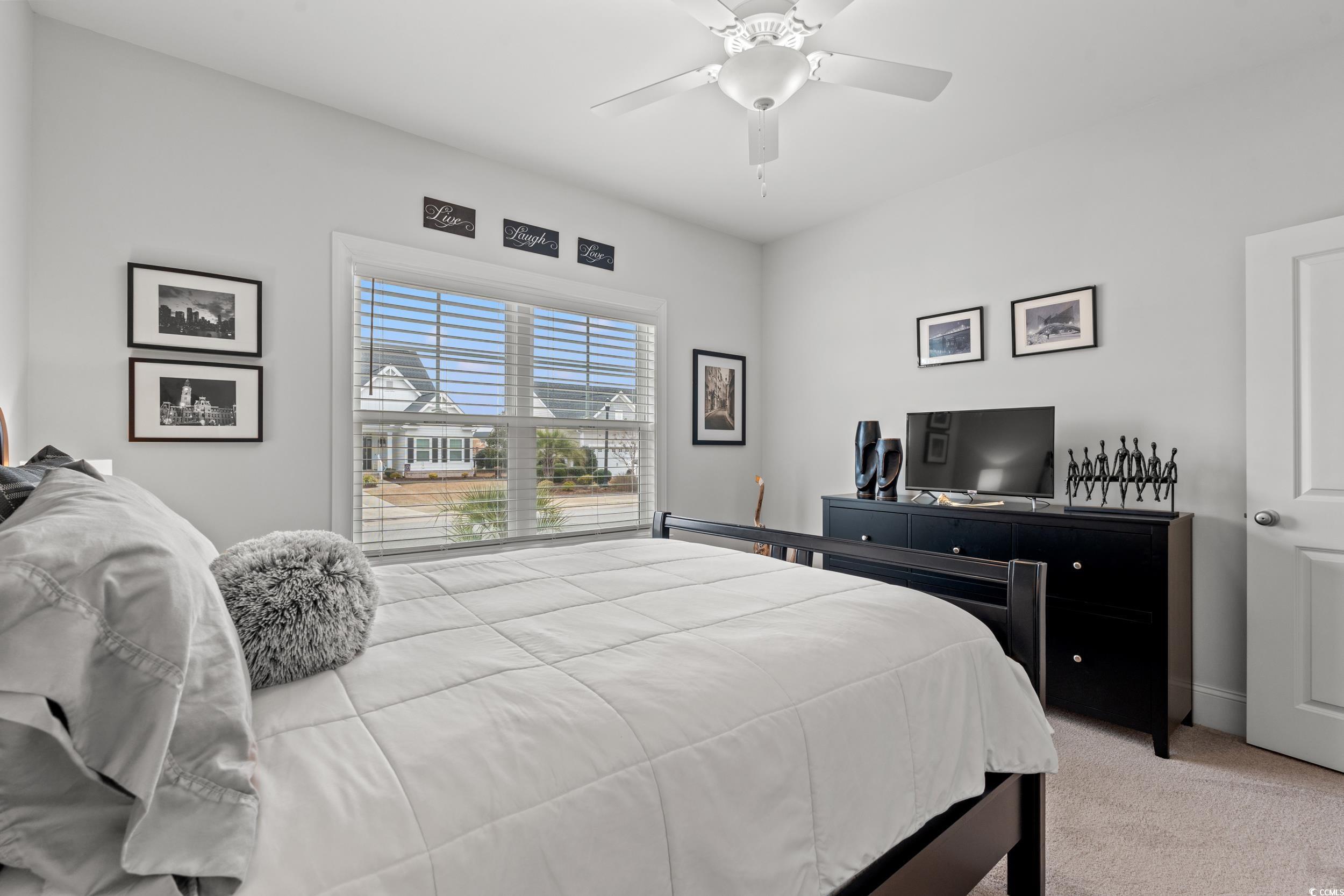 641 Indigo Bay Circle Myrtle Beach, SC 29579 - Photo 19 of 39 Bedroom featuring light carpet and ceiling fan