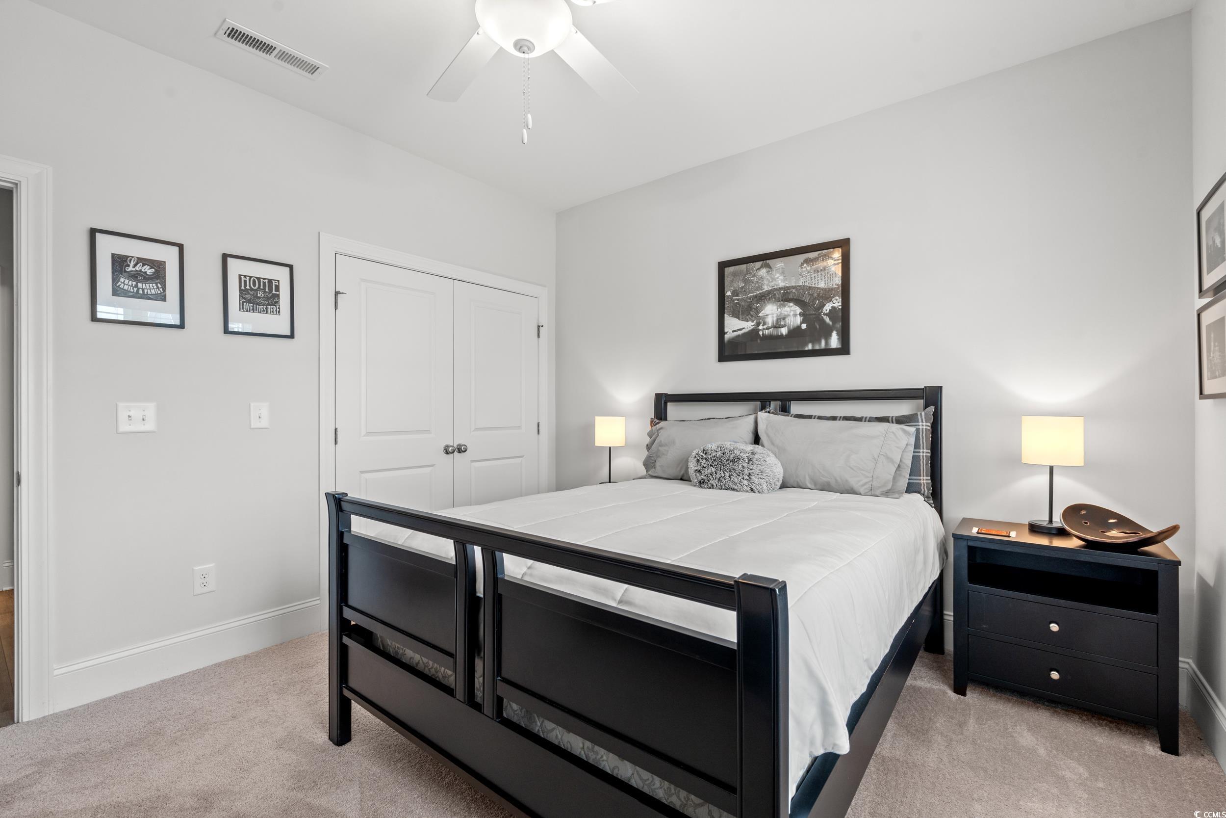 641 Indigo Bay Circle Myrtle Beach, SC 29579 - Photo 20 of 39 Carpeted bedroom featuring a closet and ceiling fa