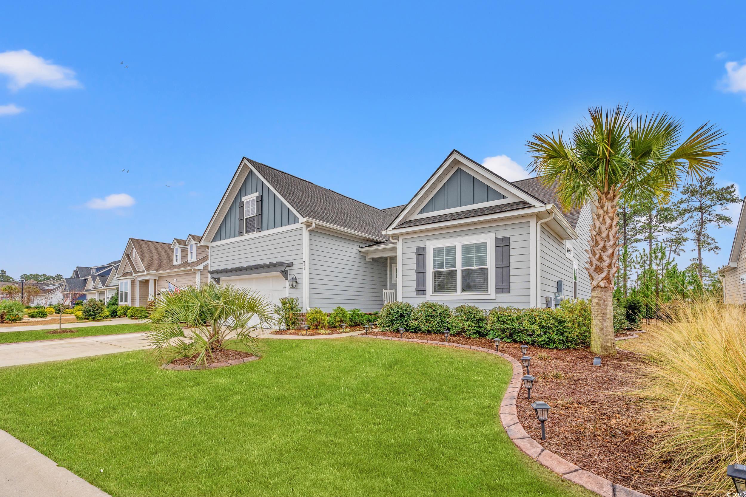 641 Indigo Bay Circle Myrtle Beach, SC 29579 - Photo 2 of 39 View of front facade featuring a garage and a fron