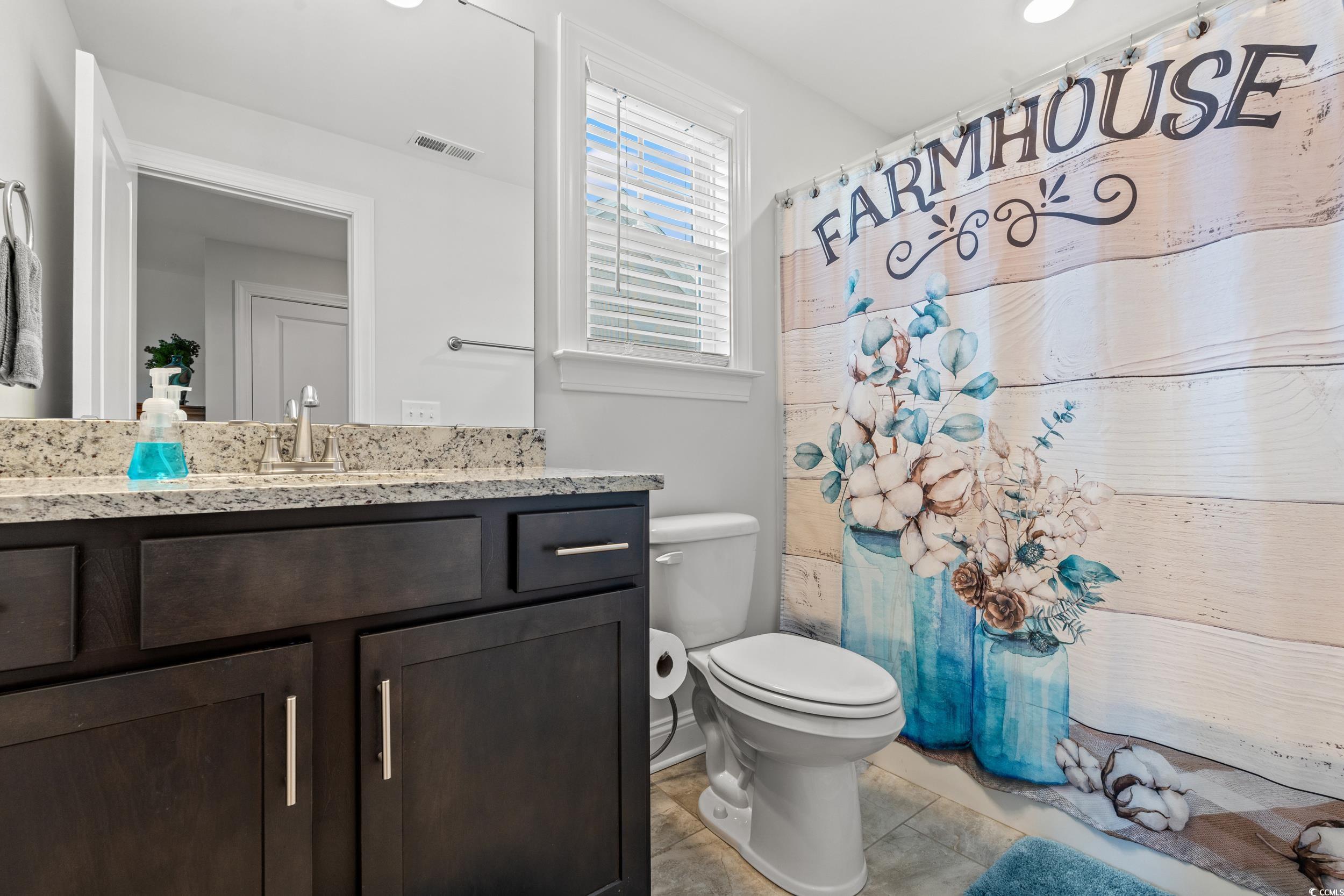 641 Indigo Bay Circle Myrtle Beach, SC 29579 - Photo 25 of 39 Bathroom with vanity, tile patterned flooring, and