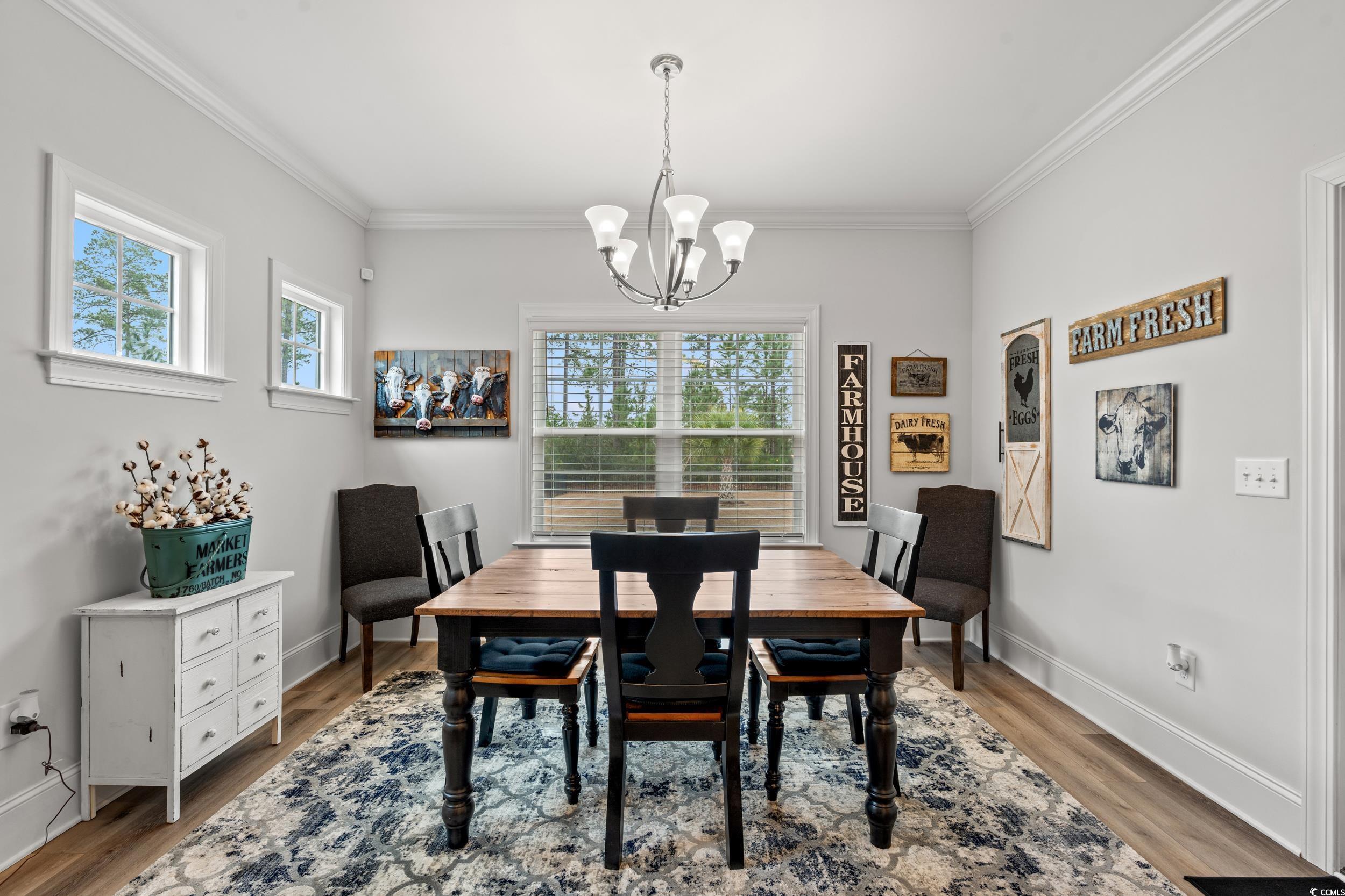 641 Indigo Bay Circle Myrtle Beach, SC 29579 - Photo 8 of 39 Dining space with crown molding, a healthy amount