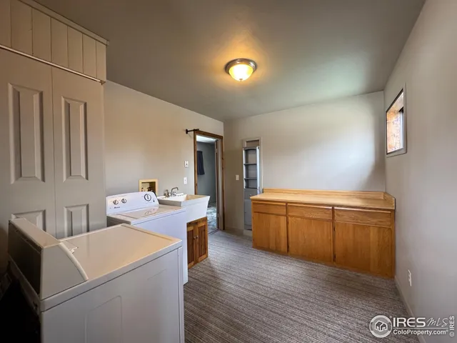 a view of a kitchen with storage and utility